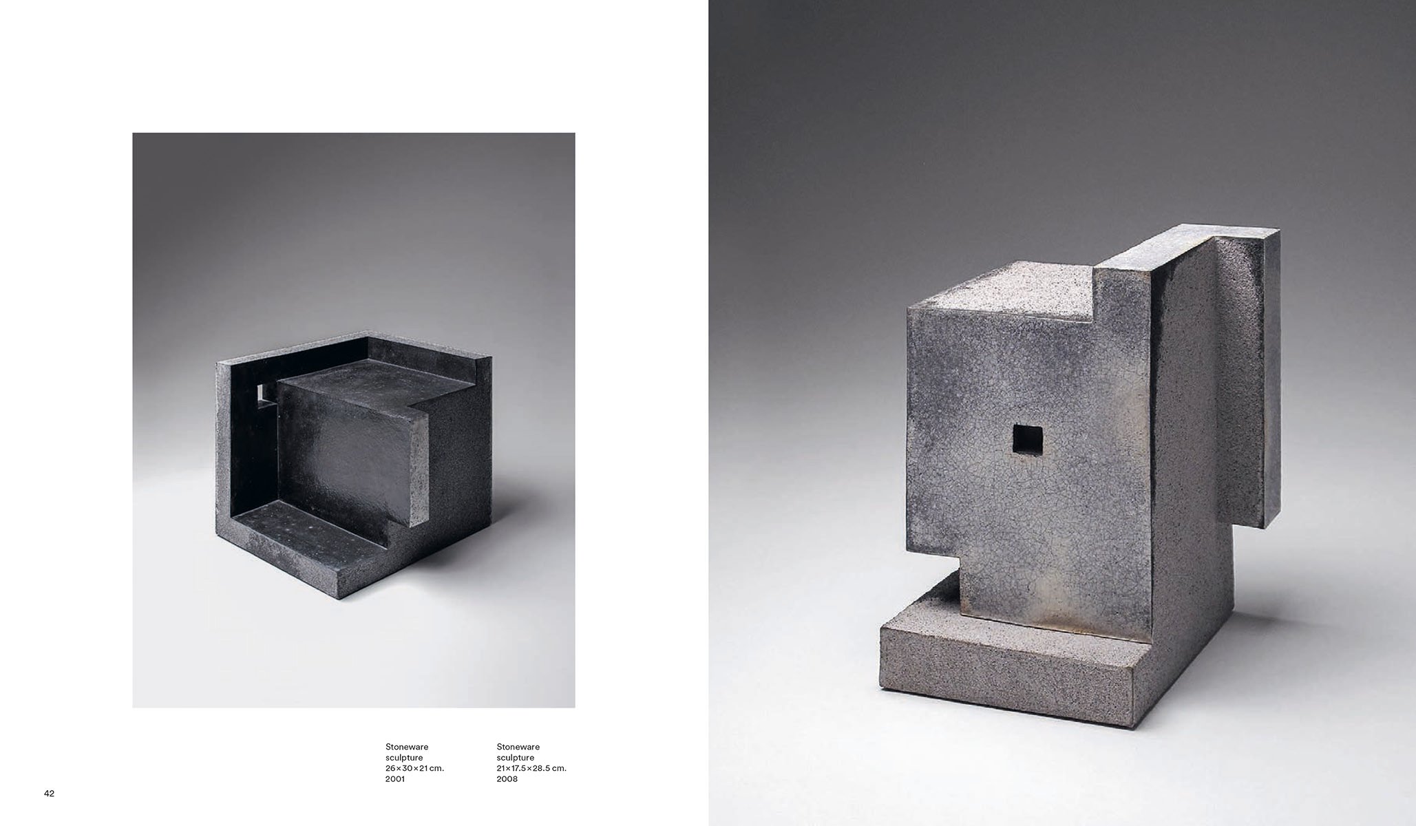 Black stoneware brick sculpture, on white cover, Enric Mestre in white font above.