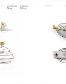 Red crushed metal sculpture, on white cover of 'Deganit Stern Schocken: How Many Is One, Jewellery / Objects / Installations', by Arnoldsche Art Publishers.