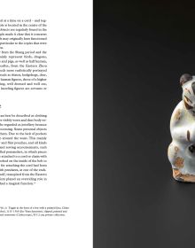Miniature ceramic cow, Chinese figure leaning on opposite side, on black cover of 'Small China, Early Chinese Miniatures', by Arnoldsche Art Publishers.
