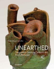 Ceramic heart with green glaze to bottom, on cover of 'Unearthed, Twentieth-Century Ceramic Art from Portugal', by Arnoldsche Art Publishers.