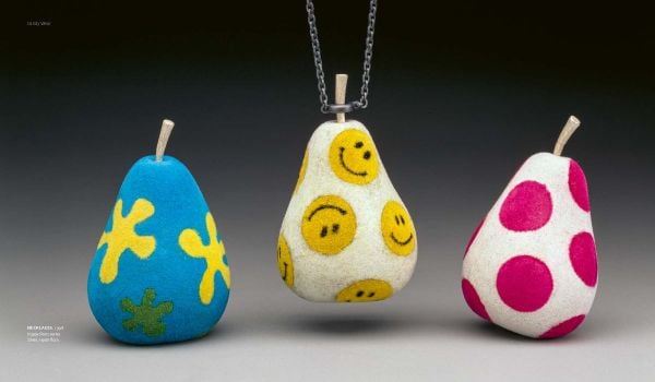 Book cover of The Art & Times of Daniel Jocz, featuring a grey shapes adorned with small gold beads. Published by Arnoldsche Art Publishers.