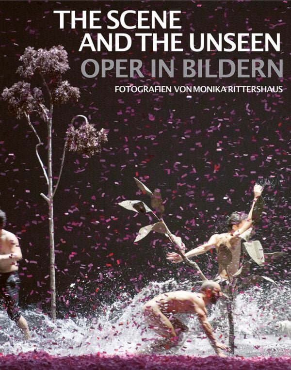 Book cover of The Scene and the Unseen, Opera in Pictures. Photographs by Monika Rittershaus, with a Opera theatre production, with three windswept figures with water splashing at feet. Published by Arnoldsche Art Publishers.