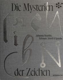 Grey cover with shiny silver font of 'Die Mysterien der Zeichen, Johannes Reuchlin, Schmuck, Schrift & Sprache', by Arnoldsche Art Publishers.