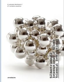 Book cover of Silver Triennial International, 20th Worldwide Competition, with silver metal ball bearings fused together. Published by Arnoldsche Art Publishers.
