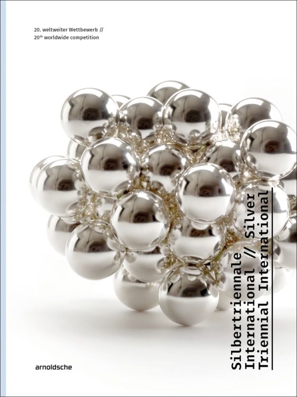 Book cover of Silver Triennial International, 20th Worldwide Competition, with silver metal ball bearings fused together. Published by Arnoldsche Art Publishers.