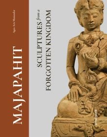 Terracotta sculpture of figure crossed-legged on plinth, on cover of 'Majapahit, Sculptures from a Forgotten Kingdom', by Arnoldsche Art Publishers.