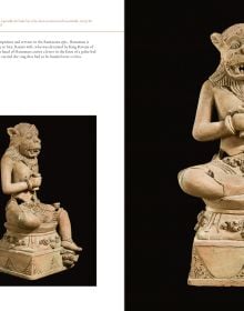 Terracotta sculpture of figure crossed-legged on plinth, on cover of 'Majapahit, Sculptures from a Forgotten Kingdom', by Arnoldsche Art Publishers.