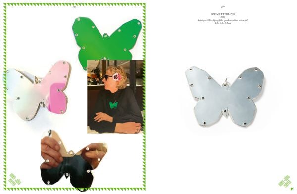 Book cover of Gabi Dziuba & Friends, with three shiny butterfly shaped pieces. Published by Arnoldsche Art Publishers.