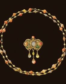 Book cover of Marcus & Co.: Three Generations of New York Jewelers, featuring an 18 Karat Gold, Plique-à-jour Enamel Pendant-Brooch and Chain. Published by Arnoldsche Art Publishers.