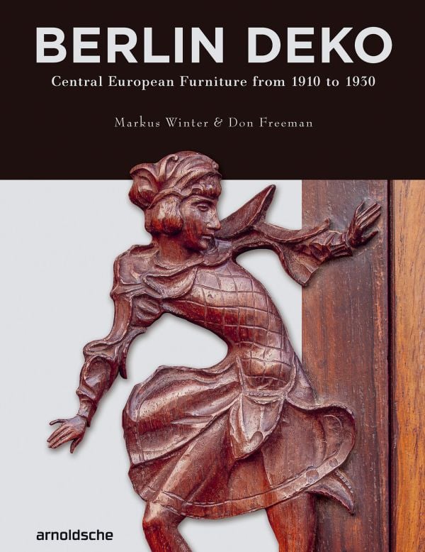 Book cover of Berlin Deko: Central European Furniture from 1910 to 1930, featuring a carved figure on the side of a piece of wood furniture. Published by Arnoldsche Art Publishers.