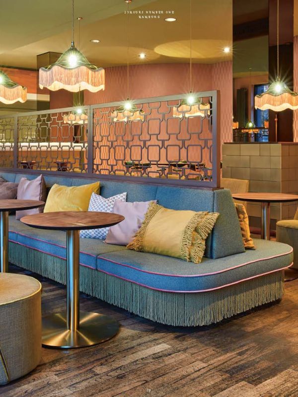 Mural of sea captain smoking a pipe on wall of luxury hotel, on cover of 'off the wall, flying thoughts: hotel, restaurant and bar design. Dreimeta 2003-2018', by Avedition Gmbh.