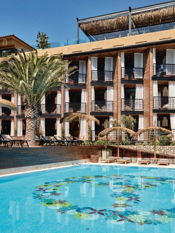 Mural of sea captain smoking a pipe on wall of luxury hotel, on cover of 'off the wall, flying thoughts: hotel, restaurant and bar design. Dreimeta 2003-2018', by Avedition Gmbh.