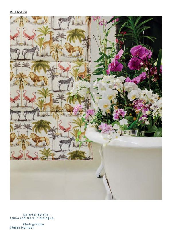 Seated figure with laptop, bright spot light, surrounded by multicoloured leaf shapes, on white cover of 'Plants at Work, An inspirational guide to greenterior design', by Avedition Gmbh.