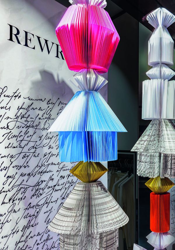 Book cover of Retail Design International Vol. 8, Components, Spaces, Buildings, with a design exhibition space, and dispensers. Published by Avedition Gmbh.