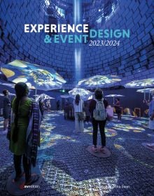 Book cover of Experience & Event Design 2023 / 2024, with exhibition space with people looking up at blue lights and umbrellas. Published by Avedition.