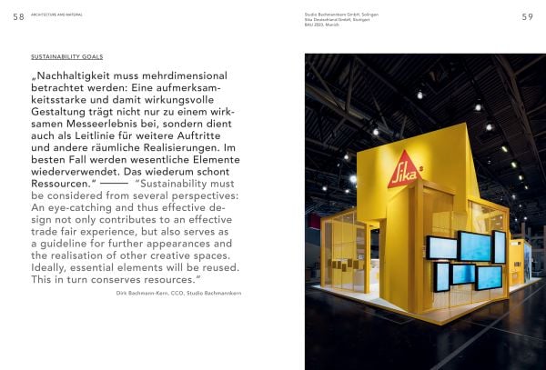 Book cover of Brand Experience & Trade Fair Design Annual 2023/24, with an interior of design exhibition with tropical foliage and metal tubes descending from above. Published by Avedition Gmbh.