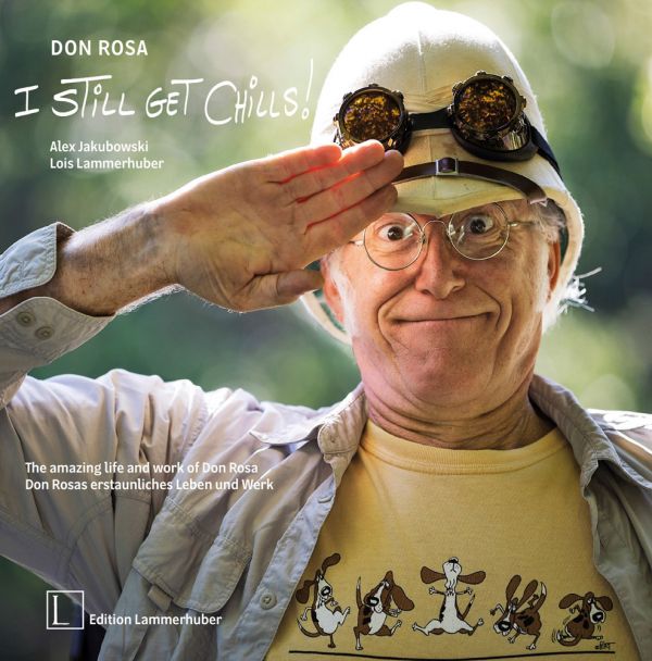Book cover of 'Don Rosa - I Still Get Chills! ; featuring Don Rosa saluting in white pith helmet and goggles. Published by Edition Lammerhuber.