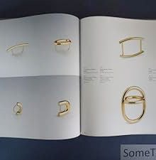 Book cover of Friedrich Becker: Kinetic Jewellery; featuring a piece of metal jewellery/ Published by Arnoldsche Art Publishers.