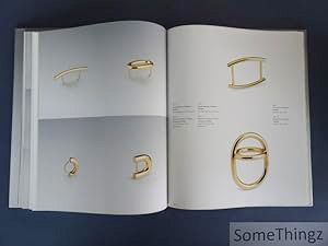 Book cover of Friedrich Becker: Kinetic Jewellery; featuring a piece of metal jewellery/ Published by Arnoldsche Art Publishers.