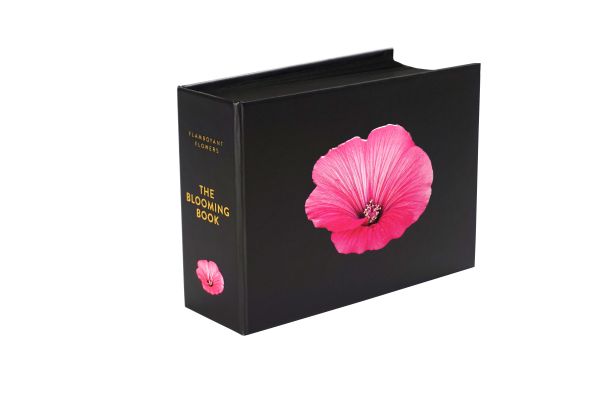 Book cover of The Blooming Book, with a close-up of a pink hibiscus flower head. Published by Seltmann Publishers.