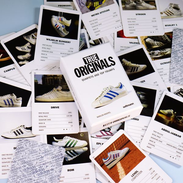 Book cover of True Originals: Quartets and top trumps, with a white adidas sneaker with blue stripes. Published by Seltmann Publishers.