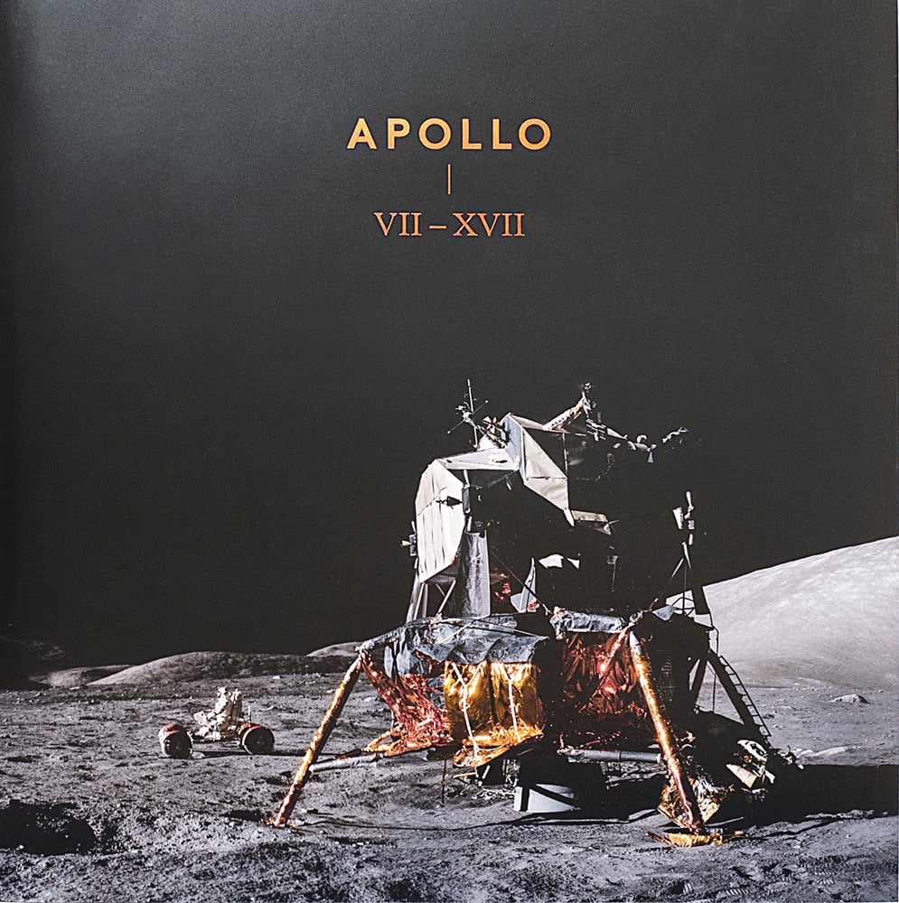 The Lunar Module Challenger, resting on moon in 1972, APOLLO VII – XVII, in gold font above.