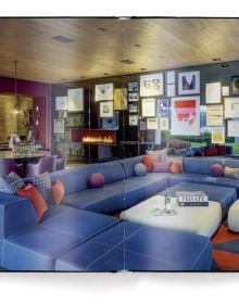 Book cover of Contemporary Design Review, with the luxury interior of Isabel London bar, with bartender pouring cocktail. Published by teNeues Books.