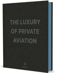 Black textured cover with The Luxury of Private Aviation in gold in centre with art deco style fan emblem beneath