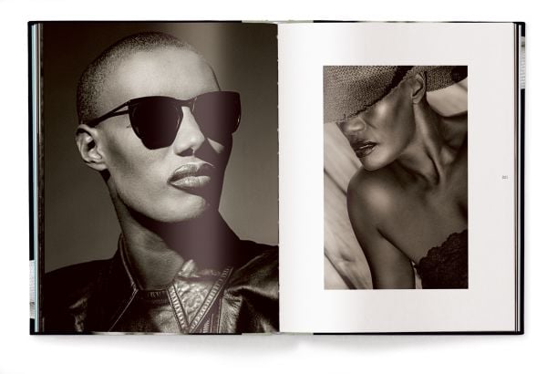 Book cover of It's Not About Me: A Retrospective, featuring Grace Jones in straw hat with black band. Published by teNeues Books.