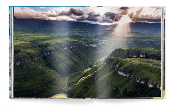 Book cover of The World, featuring an aerial view of mountainous landscape with river. Published by teNeues Books.