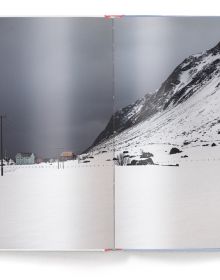 Serene snow covered Scandinavian mountain landscape with pink tinged sky, '6 months in the fridge', in white font above, by teNeues Books.