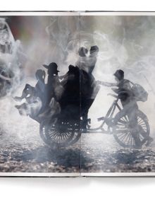 Head and shoulders photo of black girl surrounded by hazy landscape with black smoke circling her head, and Fire in white font below