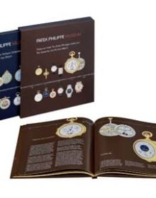 Collection of ornate Patek Philippe pocket watches, on navy cover, 'PATEK PHILIPPE MUSEUM', in white, and red font above.