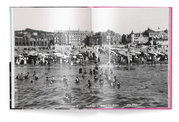 Book cover of Nostalgic Journeys: From the Orient Express to Ocean Liners, featuring actress Marlene Dietrich sitting atop a pile of suitcases. Published by teNeues Books.