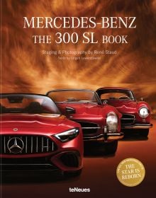 Sleek studio shot of silver-grey Mercedes Benz 300L 2 seater sports car, drivers gull wing door open, The Mercedes-Benz 300 SL Book in black font above