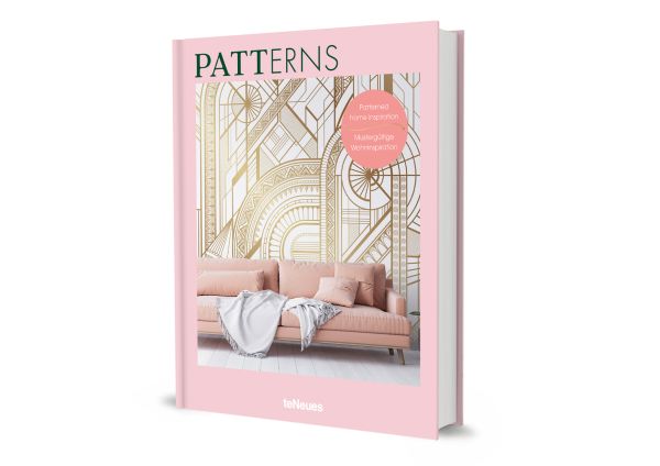 Book cover of Patterns: Patterned Home Inspiration, with white and gold patterned wallpaper, with pale pink sofa below. Published by teNeues Books.