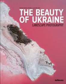 Book cover of The Beauty of Ukraine: Landscape Photography, featuring an aerial view of the pink waters of Lake Lemuria, with white salt coastline. Published by teNeues Books.
