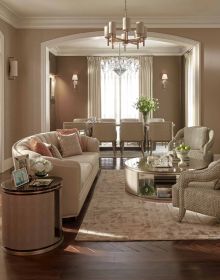 Luxurious interior with long dining table, art deco velvet chairs, chandelier above, THÁI CÔNG A PASSION FOR AESTHETICS, in gold font to top and bottom edge of black cover.