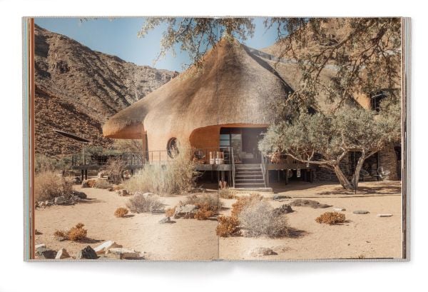 Book cover of Green Namibia, with outline of Namibian coastline. Published by teNeues Books.