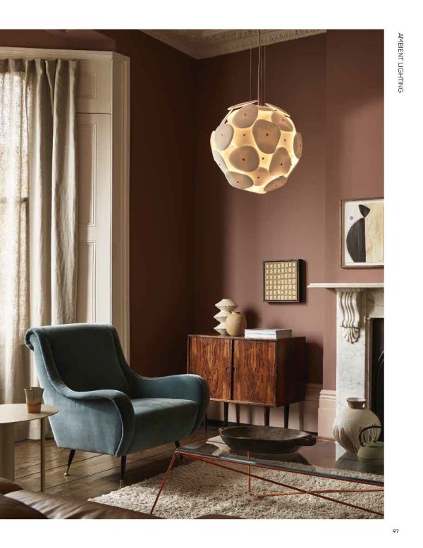 Book cover of Sculpting Light, featuring a light fixing made of blue glass. Published teNeues Books.