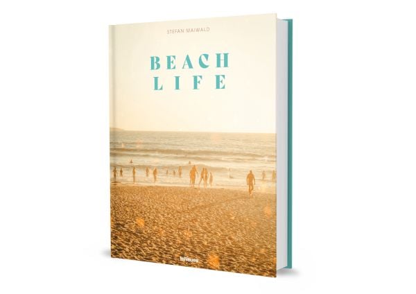Book cover of Beachlife, with sun-goers at the beach paddling in the water, under a hazy sun. Published by teNeues Books.