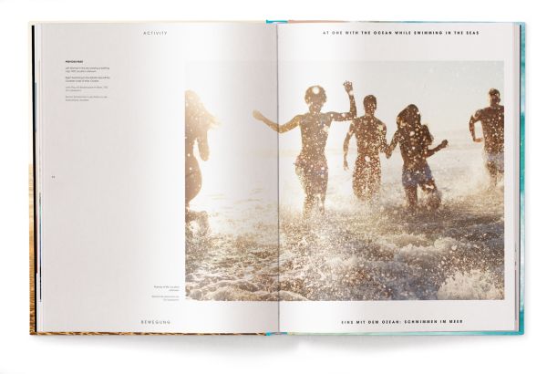 Book cover of Beachlife, with sun-goers at the beach paddling in the water, under a hazy sun. Published by teNeues Books.
