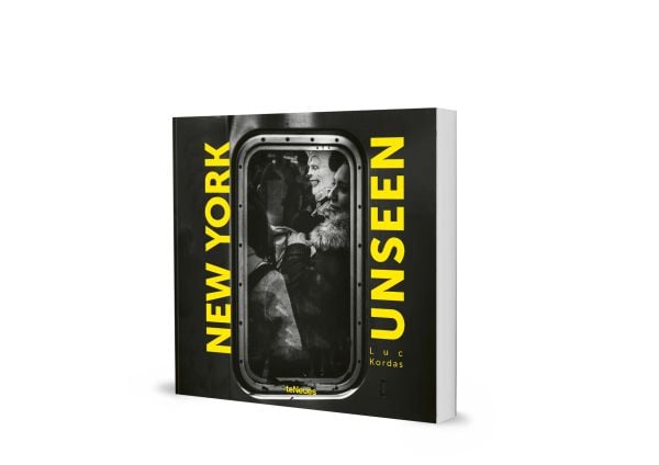 Book cover of New York Unseen, with the view of a window of packed commuter train, with passenger wearing clown mask. Published by teNeues Books.