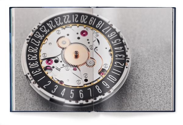 Book cover of The Watch Book – Oris, with close-up of a watch mechanism. Published by teNeues Verlag.