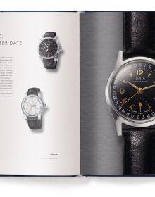 Watch mechanism with blue filter on cover of 'The Watch Book – Oris', by teNeues Verlag.