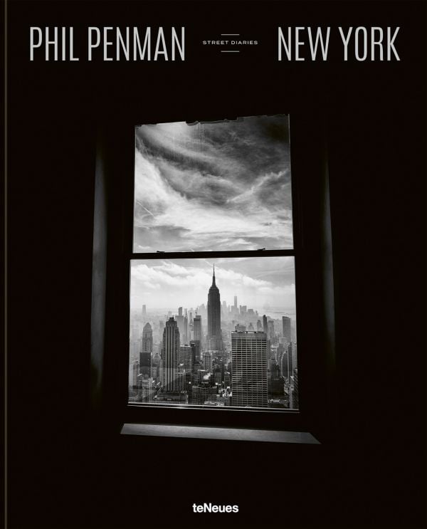 Book cover of New York Street Diaries, with a dark room looking out on cityscape with Empire State Building. Published by teNeues Books.