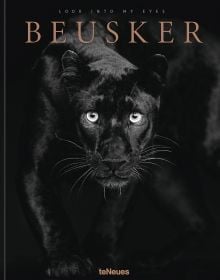 Book cover of Beusker, Look into my Eyes, with a black panther with silvery-grey eyes staring at the camera. Published by teNeues Books.