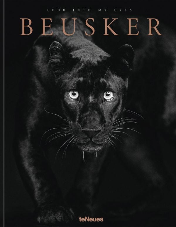 Book cover of Beusker, Look into my Eyes, with a black panther with silvery-grey eyes staring at the camera. Published by teNeues Books.
