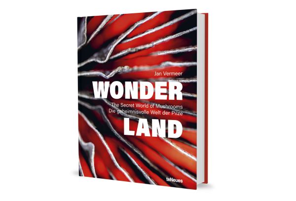 Book cover of Wonderland: The Secret World of Mushrooms, with close-up of mushroom ridges. Published by teNeues Books.