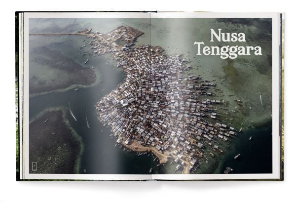 Book cover of Manolo Ty's Tropics & Traditions: Tales of Indonesia, with a young child walking through a river. Published by teNeues Books.